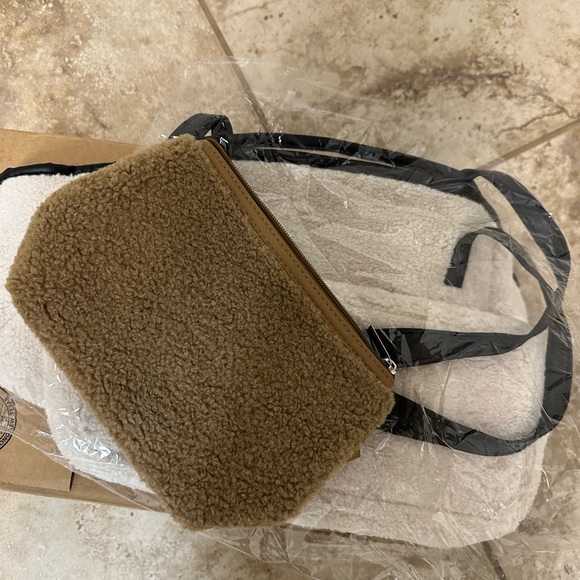 Tote Bag in cream ;Neiman Marcus
Faux Shearling Tote with makeup bag - Picture 9 of 9